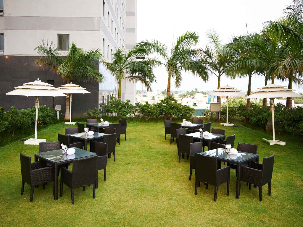 open lawn with brown chairs in round