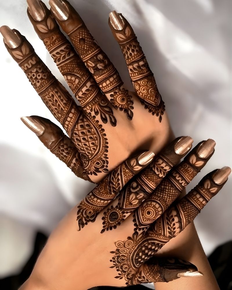 Back hand mehndi design with detailed finger patterns