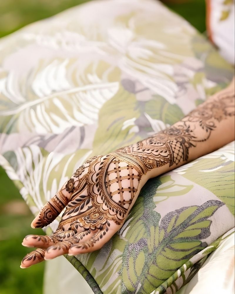 Mehndi paste drying on hands during the waiting stage